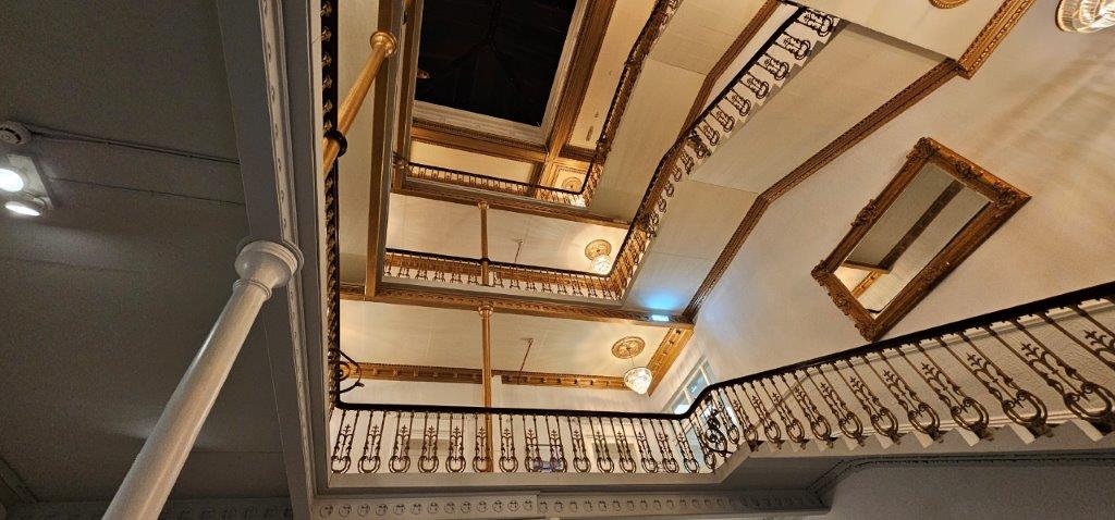 The grand staircase at The Queen at Chester Hotel