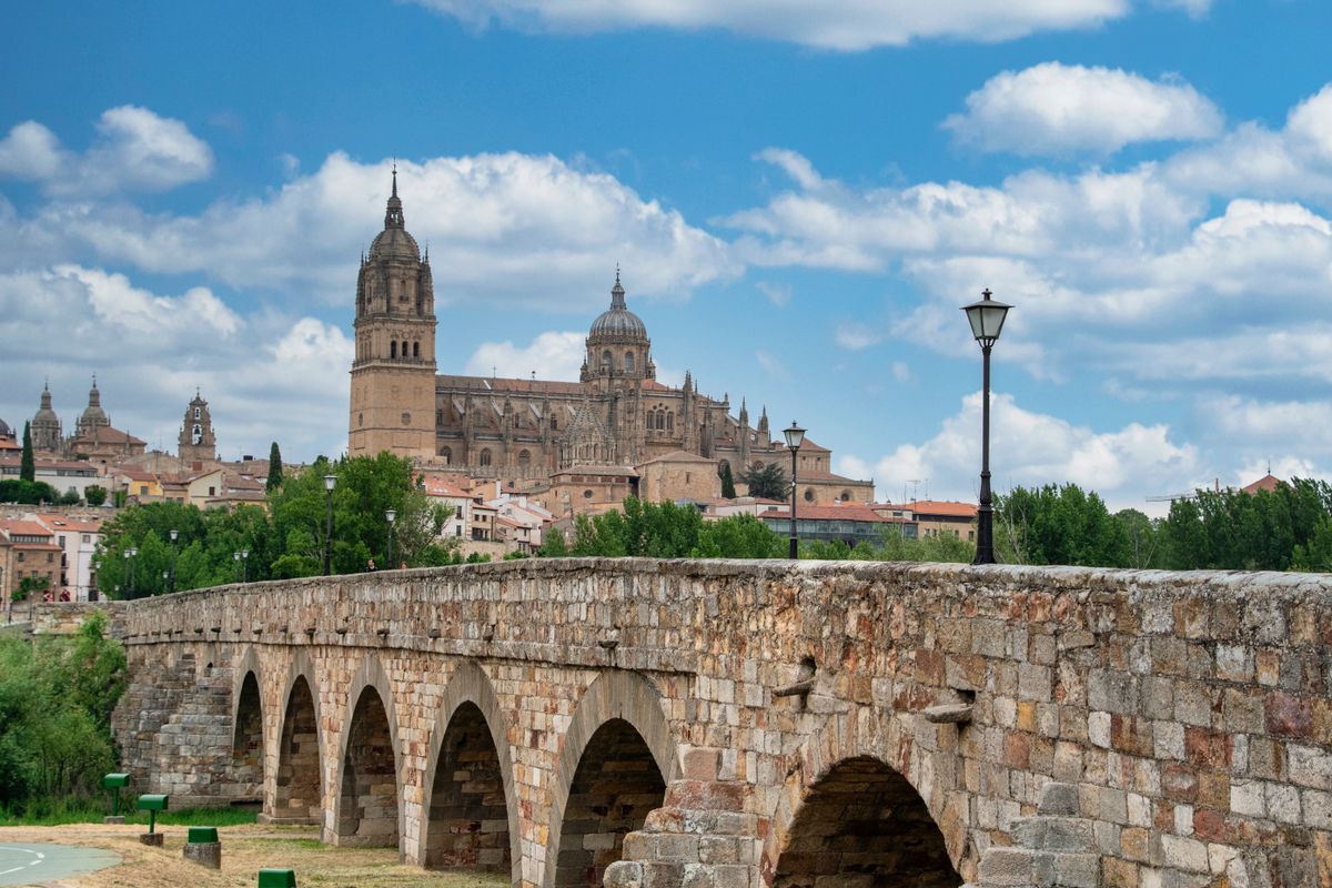 The Roman Bridge in Salamanca with the cathedral on the skyline behind