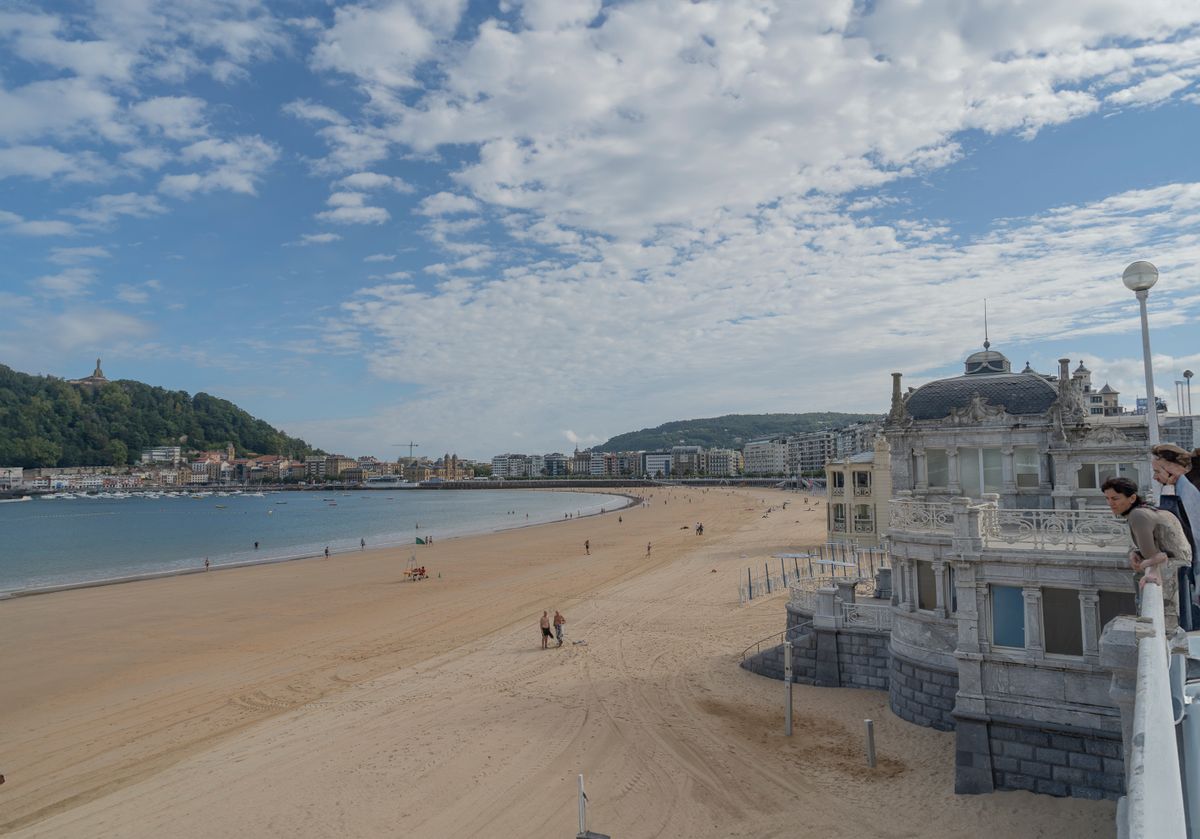 The sand and seafront buildings of La Concha Beach in San Sebastian